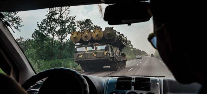  A military rocket launcher drives on a highway towards Lysychansk, Ukraine, Sunday June 12, 2022. 