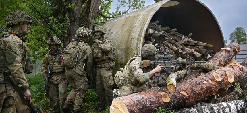 Soldiers from Royal Welsh Battlegroup take part in maneuvers during NATO exercise Hedgehog on the Estonian Latvian border on May 26, 2022 in Voru, Estonia. 