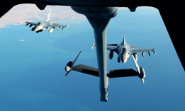 Two F-16 Fighting Falcons fly in formation behind a KC-10 Extender from Al Dhafra Air Base, United Arab Emirates, Dec. 25, 2021. 