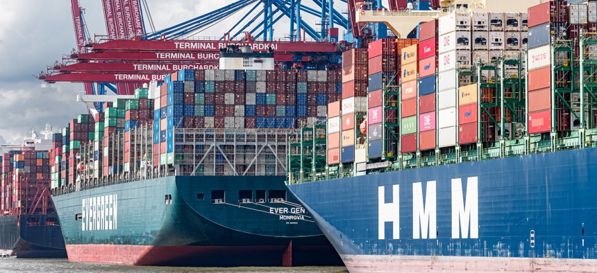 Container ships are moored for loading and unloading at the Burchardtkai terminal in the Port of Hamburg, June 10, 2022.