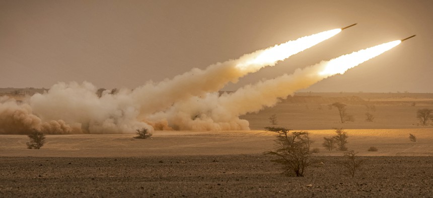 US M142 High Mobility Artillery Rocket System (HIMARS) launchers fire salvoes during the "African Lion" military exercise in the Grier Labouihi region in southeastern Morocco on June 9, 2021.