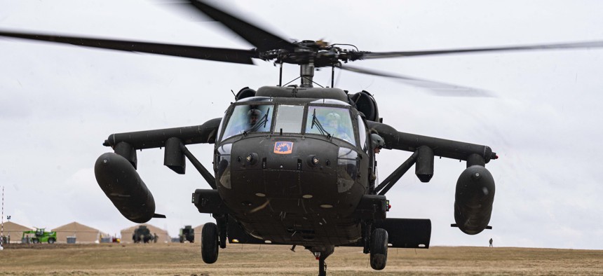 A U.S. Army UH-60 Black Hawk helicopter lands in order to refuel at a refueling point in Zamosc, Poland, March 5, 2022.