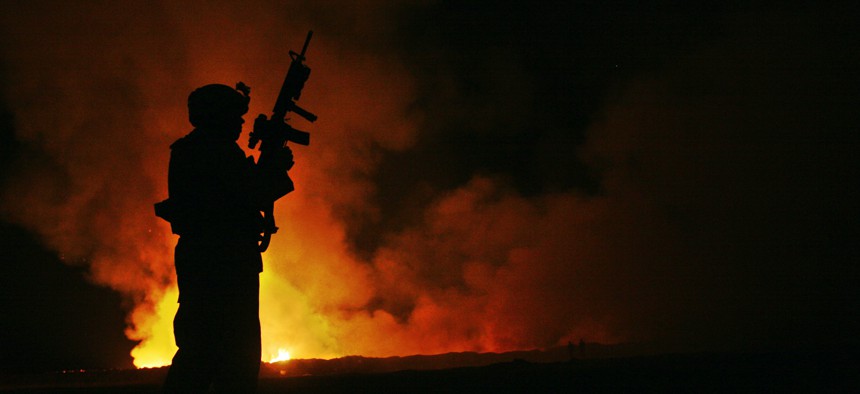 When a burn pit fire got out of control in May 2007 at Camp Fallujah, Sgt. Robert B. Brown of Regimental Combat Team 6's Combat Camera Unit documented the civilian firefighters tackling the blaze.