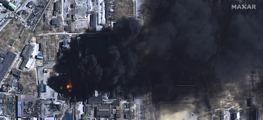 Maxar satellite imagery of burning oil storage tanks in Chernihiv, Ukraine.
