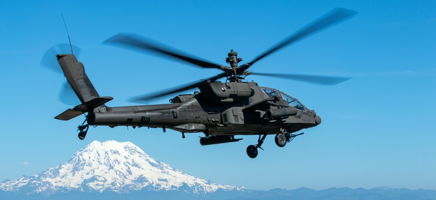 Col. Shane Finison, commander of the 16th Combat Aviation Brigade, flies an AH-64E Apache helicopter near Tacoma, Wash., on Jul. 11, 2022.