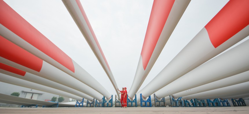 New wind turbine blade sit parked at a factory on July 15, 2022 in Handan, Hebei Province of China.