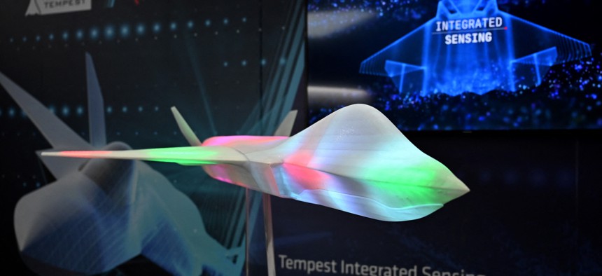 A model of the proposed jet fighter aircraft Tempest, a joint programme by a consortium known as "Team Tempest", which includes Britain's Ministry of Defence, BAE Systems, Rolls-Royce, Leonardo SPA, MBDA and Saab, is pictured in the BAE hall during the Farnborough Airshow, in Farnborough, on July 18, 2022. 