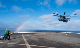 An MH-53E Sea Dragon helicopter, attached to the “Blackhawks” of Helicopter Mine Countermeasures Squadron (HM) 15, prepares to land on the flight deck of San Antonio-class amphibious transport dock ship USS Portland (LPD 27) as part of Rim of the Pacific (RIMPAC) 2022, July 12 in Southern California. 
