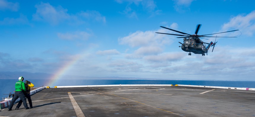 An MH-53E Sea Dragon helicopter, attached to the “Blackhawks” of Helicopter Mine Countermeasures Squadron (HM) 15, prepares to land on the flight deck of San Antonio-class amphibious transport dock ship USS Portland (LPD 27) as part of Rim of the Pacific (RIMPAC) 2022, July 12 in Southern California. 