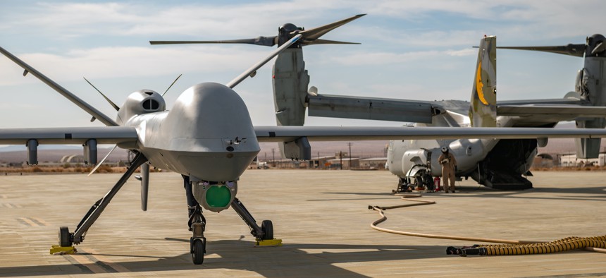 An MQ-9 Reaper assigned to the 163 Attack Wing, March Air Reserve Base stages for refueling on the Strategic Expeditionary Landing Field on Marine Corps Air Ground Combat Center Twentynine Palms, California, July 21, 2022.