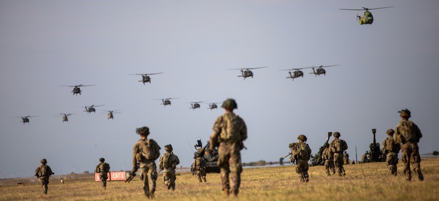 U.S. soldiers participate with their Romanian counterparts in a combined land and air training at Mihail Kogălniceanu Air Base, Romania, July 28, 2022.