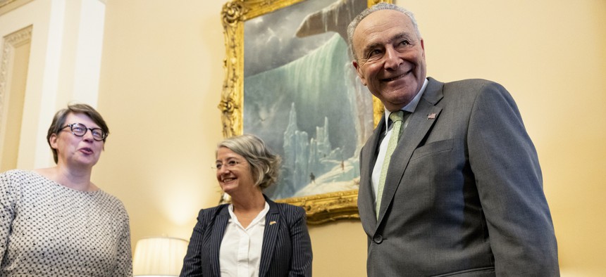 Senate Majority Leader Chuck Schumer (D-NY) (R) poses for a photo with the Ambassador of Sweden to the U.S. Karin Olofsdotter (C) and Finnish Minister Counselor Päivi Nevala, (L) in his office at the U.S. Capitol Building on August 3, 2022.