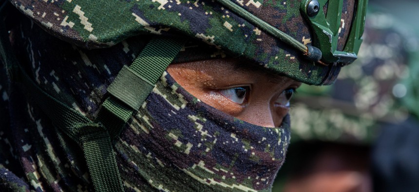 A soldier participates in an amphibious landing drill during the Han Kuang military exercise, which simulates China's People's Liberation Army (PLA) invading the island, on July 28,