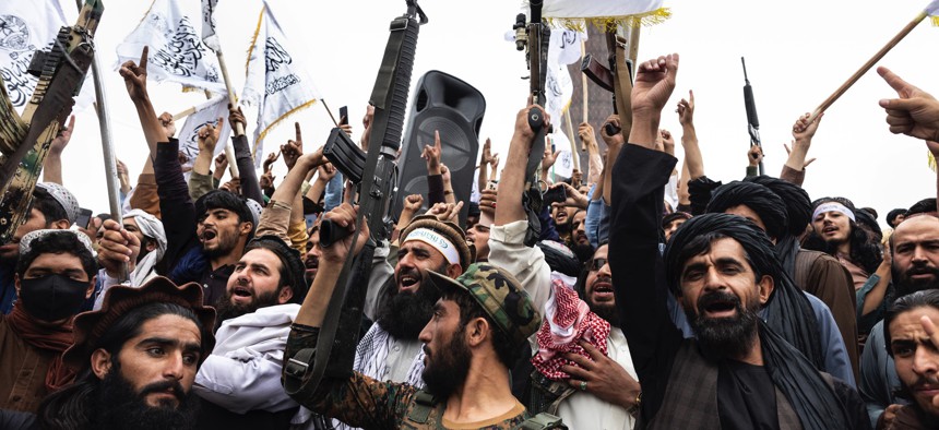 Taliban take to the streets during a national holiday celebrating the first anniversary of the Taliban takeover on August 15, 2022, in Kabul, Afghanistan. 