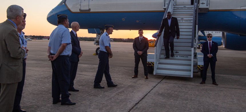 Defense Secretary Lloyd Austin III is greeted by defense attaché Capt. Manuel Picon and others on June 28, 2022, as he arrived in Madrid, Spain,for the NATO Summit. 