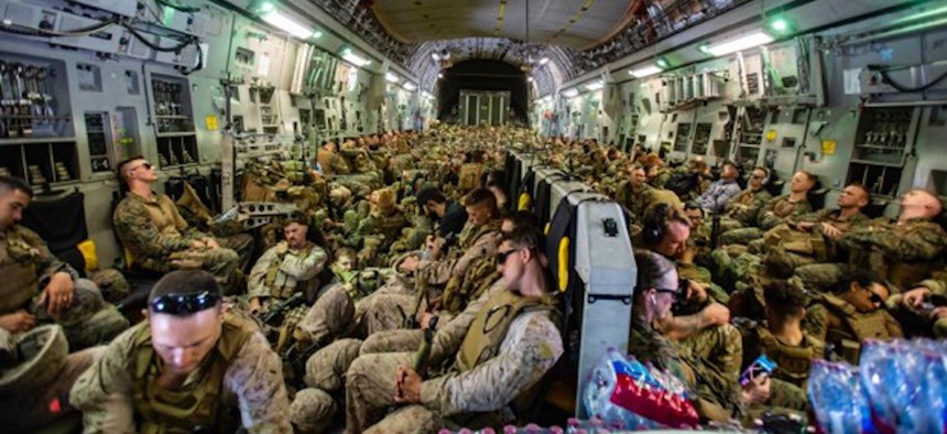 Marines assigned to the 24th Marine Expeditionary Unit (MEU) fly to Hamid Karzai International Airport, Kabul, Afghanistan, August 17, 2021.