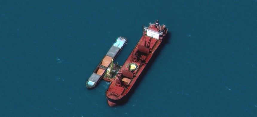 This Maxar GeoEye-1 image of ships in the Black Sea was collected July 7, 2022. In the zoomed-in view, a Russian cargo ship (on the left) transfers Ukrainian grain to a bulk carrier (on the right) in the Black Sea. Maxar's Crow’s Nest Maritime Monitoring and Security product provided insights that the cargo ship’s Automatic Identification System signal was turned off.