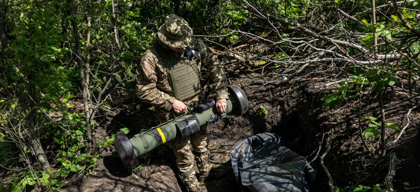A Ukrainian Army soldier places a U.S.-made Javelin missile in a fighting position on the frontline on May 20, 2022, in Kharkiv Oblast, Ukraine.