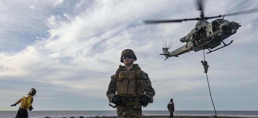 U.S. Marines with Battalion Landing Team 2/5, 31st Marine Expeditionary Unit, fast rope and extract during fast rope training aboard USS New Orleans (LPD 18) in the Sea of Japan, Sept. 5, 2022.