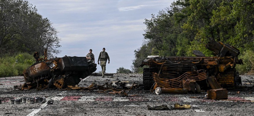 Destroyed armored vehicles litter the road in Balakliya, Kharkiv region, on September 10, 2022.