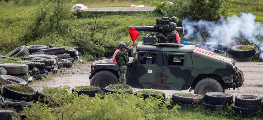 Taiwanese solders launch a missile during a 2-day live-fire drill in Taiwan on September 7, 2022, amid intensifying military threats from China.