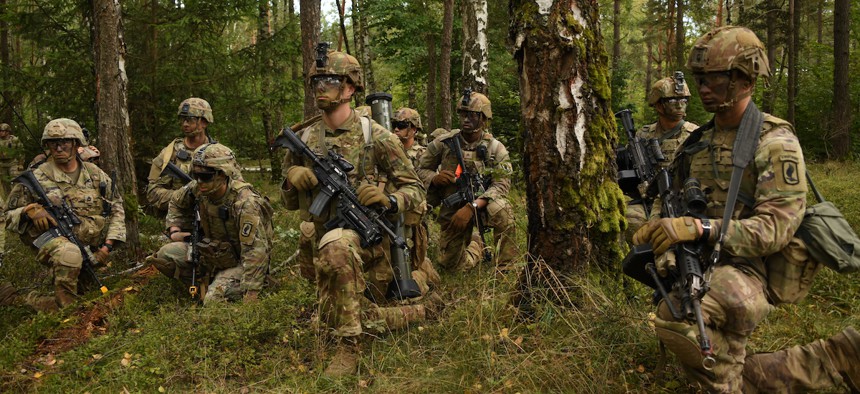 U.S. Army paratroopers assigned to 173rd Airborne Brigade Combat Team prepare to move out during a combined arms blank fire exercise at the Grafenwoehr Training Area, Germany, Sept. 21, 2022. 