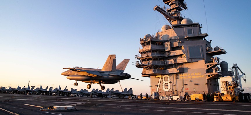 An F/A-18E Super Hornet, attached to the "Ragin' Bulls" of Strike Fighter Squadron (VFA) 37, lands on the flight deck of USS Gerald R. Ford on April 19, 2022. 