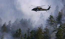 Oregon Army National Guard pilots navigate through smoke on the way to their drop site in support of firefighting ground crews in 2015.