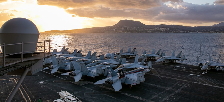 The Nimitz-class aircraft carrier USS George H.W. Bush arrives in Souda Bay, Crete for a scheduled port visit, Oct. 6, 2022.
