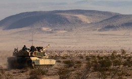 A M1A2 Abrams from the 2nd Armored Brigade Combat Team, 1st Infantry Division travels to its next checkpoint at the National Training Center on Fort Irwin, California, August 6, 2022. 