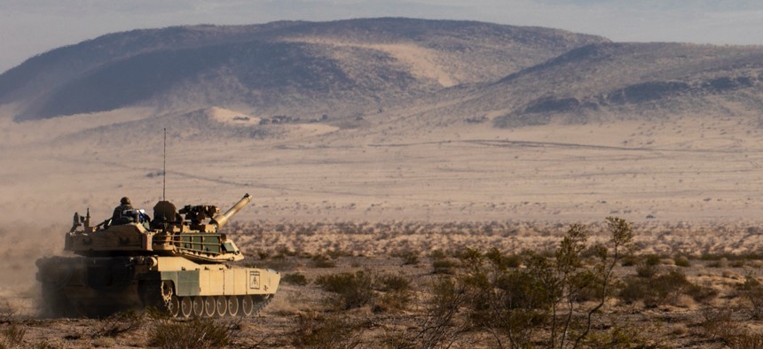 A M1A2 Abrams from the 2nd Armored Brigade Combat Team, 1st Infantry Division travels to its next checkpoint at the National Training Center on Fort Irwin, California, August 6, 2022. 
