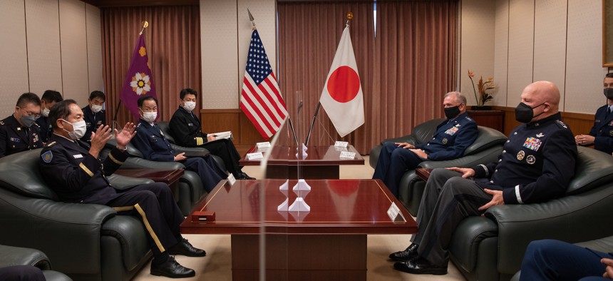  U.S. Space Force Gen. John W. Raymond, Chief of Space Operations, and his staff, right, speaks with Chief of Staff of the Japan Joint Staff, Gen. Koji Yamazaki, and his staff, left, during his visit to engage with senior officials from Japan’s Ministry of Defense, in Tokyo, Japan, Oct. 5, 2022. 