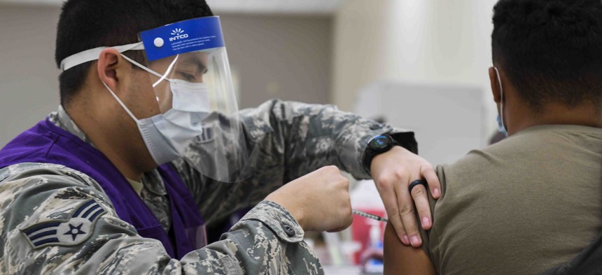 A U.S. Air Force pilot receives the COVID-19 vaccine at Fairchild Air Force Base, Washington, Jan. 21, 2021. The Biden administration has announced a strategy that, among other goals, aims to bring the timeline for developing new vaccines down to 100 days.