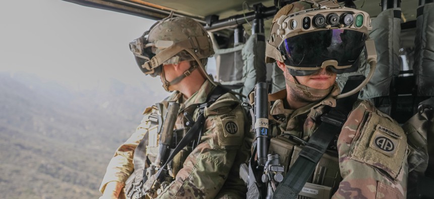 U.S. Army Sgt. Jared Row and Spc. Jordan Deblasi, assigned to 82nd Airborne 3rd Brigade Combat Team, observe area of operations during Project Convergence (PC22) at Camp Talega on Camp Pendleton, California on Oct. 12, 2022.