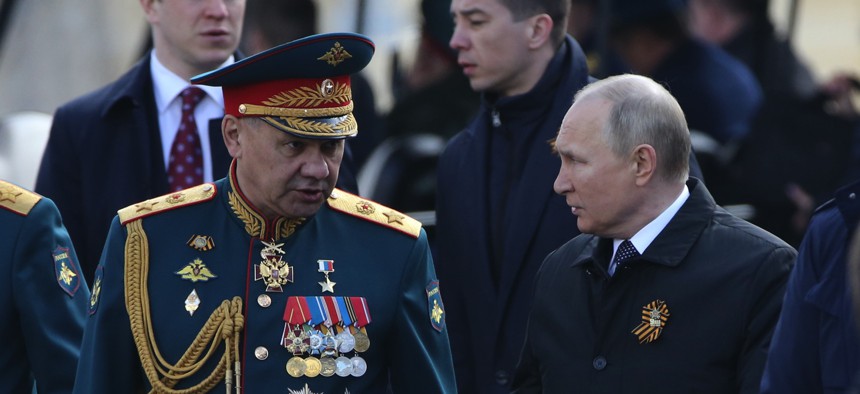 Russian Defence Minister Sergei Shoigu, left, and President Vladimir Putin attend the Victory Day Parade at Red Square on May 9, 2022, in Moscow, Russia.
