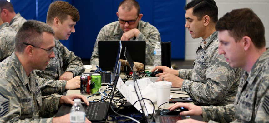 Military teams compete in offensive and defensive cyber operations during the 24th Air Force Cyber Competition in San Antonio, Texas, June 6, 2019.