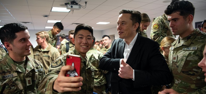 In this April 2022 photo, SpaceX CEO Elon Musk takes selfies with future U.S. Space Force officers at the U.S. Air Force Academy in Colorado Springs, Colo.