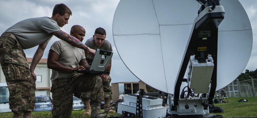 In this 2017 photo, U.S. Air Force communications technicians establish network connectivity for the Air Force Special Operations Command Air Rapid Response Kit (ARRK) at Kadena Air Base, Japan. 