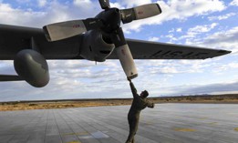 Air Force Staff Sgt. Solomon Walker prepares a C-130H Hercules aircraft for takeoff at Yuma Proving Ground, Ariz., Jan. 29, 2021.
