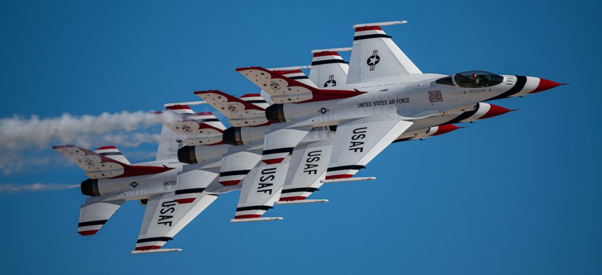F-16 Fighting Falcon fighter jets assigned to the U.S. Air Force Air Demonstration Squadron “Thunderbirds” perform an aerial demonstration during the Aviation Nation 2022 airshow at Nellis Air Force Base, Nevada, Nov. 4, 2022. 