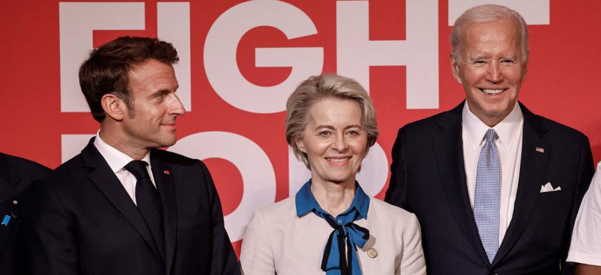 From L to R, French President Emmanuel Macron, EU Commission President Ursula von der Leyen and US President Joe Biden smile at the end of the Global Fund Seventh Replenishment Conference in New York on September 21, 2022.