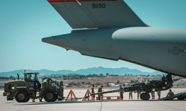 A U.S. Marine Corps M777 towed 155 mm howitzer is loaded into the back of a U.S. Air Force C-17 Globemaster III aircraft at March Air Reserve Base, California, April 23, 2022.