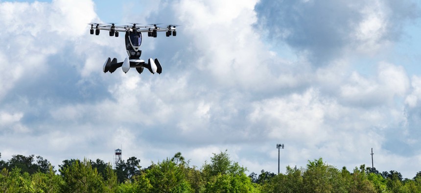 In the 2023 defense policy bill, lawmakers urge the intelligence community to look at tech-innovation efforts like the Air Force's AFWERX, which sponsored this May 2022 demonstration of Lift Aircraft’s Hexa aircraft at Hurlburt Field, Florida. 