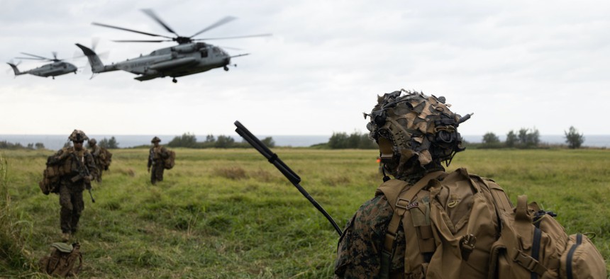 U.S. Marines with Battalion Landing Team 1/4, 31st Marine Expeditionary Unit, prepare for extraction during a helicopter raid exercise on Ie Shima, Okinawa, Japan, Dec. 13, 2022. 