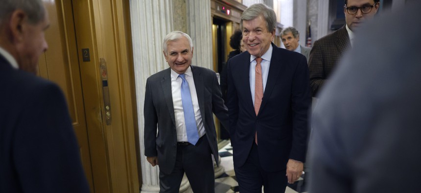 Sen. Jack Reed, D-RI, left, and Sen. Roy Blunt, R-MO, head for the Senate Chamber for a procedural vote on the 2023 omnibus spending legislation at the U.S. Capitol on December 20, 2022.
