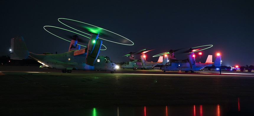 U.S. Marine Corps MV-22 Osprey aircraft assigned to Marine Medium Tiltrotor Squadron 162 (Reinforced), 26th Marine Expeditionary Unit, prepare to take-off prior to conducting a simulated raid during Marine Expeditionary Unit Exercise (MEUEX) I at Marine Corps Auxiliary Landing Field Bogue, North Carolina, Dec. 20, 2022.