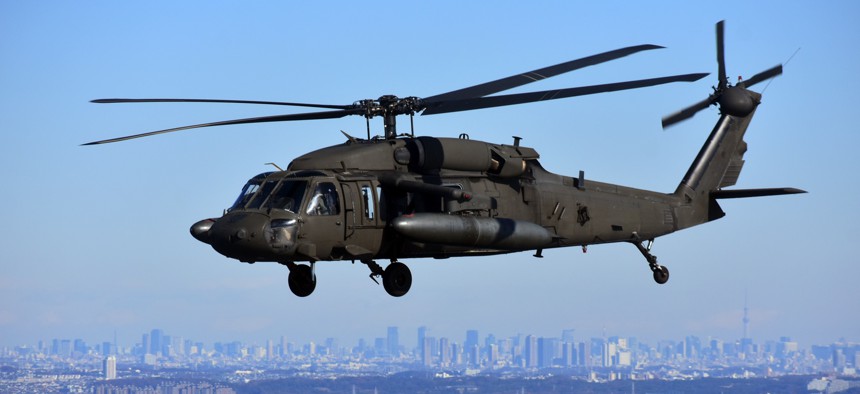 A Black Hawk helicopter with the U.S. Army Aviation Battalion Japan participates in a First Flight rehearsal with Japan Ground Self-Defense Force members near Yokohama, Japan, on Dec. 16, 2018.