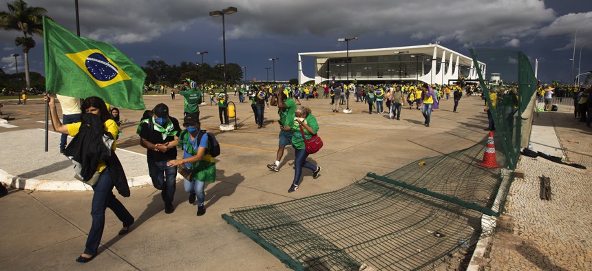 Supporters of former President Jair Bolsonaro clash with security forces as they break into Planalto Palace and raid Supreme Court in Brasilia, Brazil, on Jan. 8, 2023. 