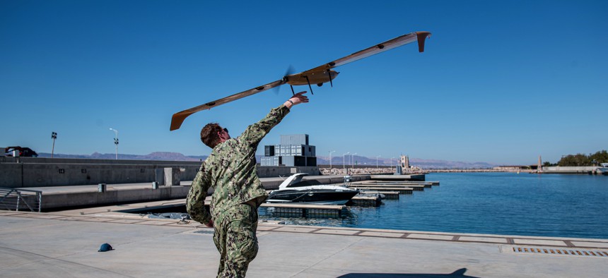 Lt. j.g. Jay Faylo assigned to Task Force 59, launches an M5D Airfox unmanned ariel system during International Maritime Exercise/Cutlass Express 2022.