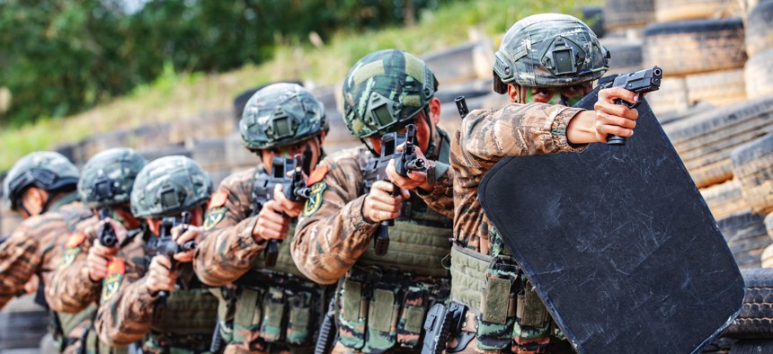 Special forces soldiers conduct a tactical formation training in Fangchenggang city, Guangxi province, China, Jan. 4, 2023. 